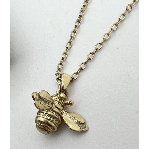 1062 - A gold tone bumble bee pendant necklace by Ted Baker, complete with original pouch, box and care car... 