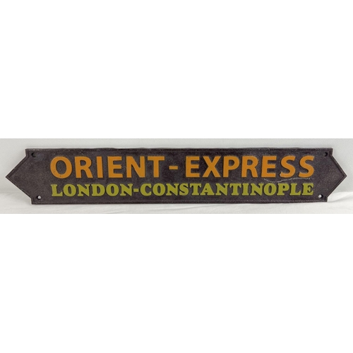 1149 - A painted cast iron Orient Express wall plaque, with fixing holes. Approx. 57cm long.