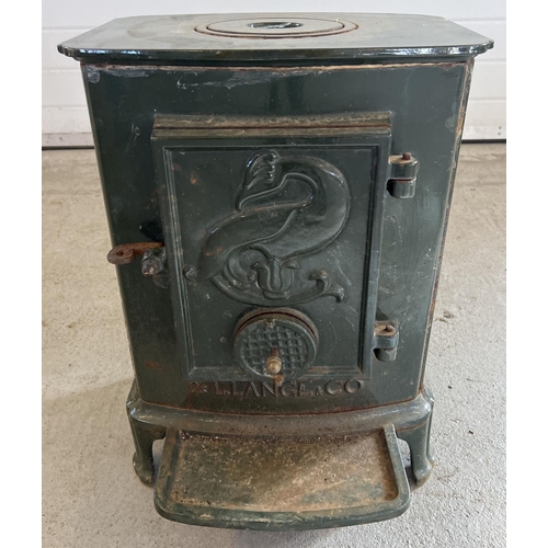 1152 - A vintage L. Lange & Co cast iron wood burner, painted green. Approx. 53cm tall x 38.5cm wide.