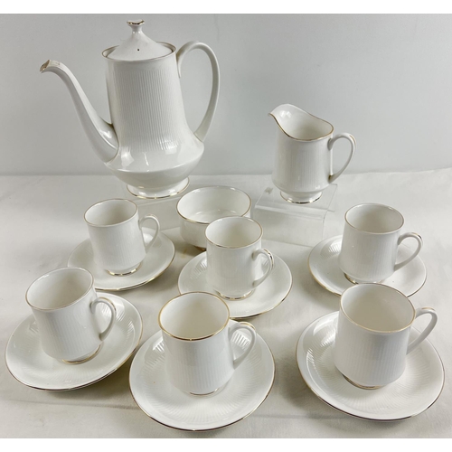 1186 - A vintage bone white china coffee set by Royal Standard, with gold rim detail. Comprising: 6 coffee ... 