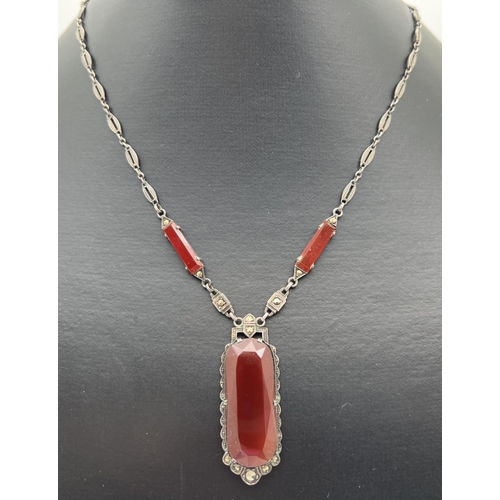 1001 - A vintage  Art Deco style silver drop pendant necklace set with carnelian and marcasite's. Silver ma... 