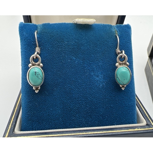 1030 - 2 pairs of 925 silver drop earrings set with semi precious stones. A pair of fixed post earrings wit... 