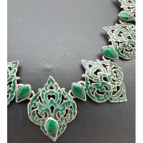 1042 - A vintage Siam silver oriental design necklace with 7 pierced work green enamelled panels. Double ho... 