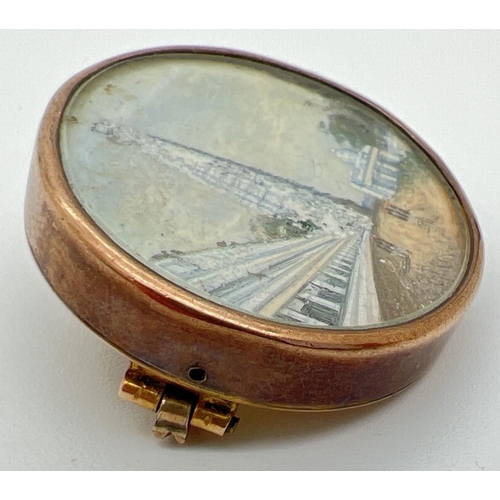 1045 - An antique miniature oil painting in a 9ct gold oval brooch. Painting depicts soldiers walking withi... 