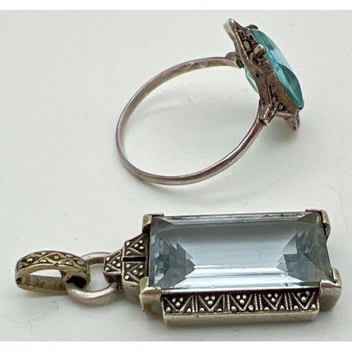 1046 - 2 vintage silver Art Deco jewellery items. A dress ring set with a blue stone & marcasite's and a re... 