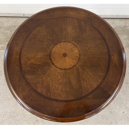 1393 - A modern circular shaped drum table raised on 4 squared shaped tapered legs and with central draw. I... 