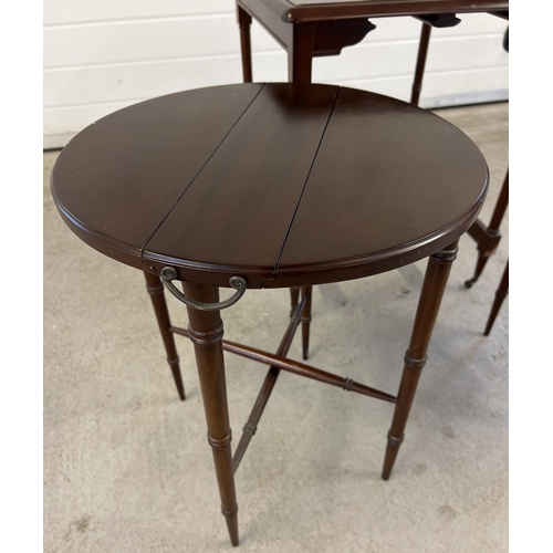 1394 - A vintage dark wood nest of 3 tables with 2 small drop leaf folding tables and larger square shaped ... 