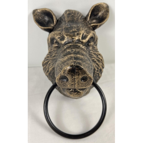 1161 - A bronzed effect painted cast iron wall hanging Boar head with metal ring. Approx 18cm tall (not inc... 