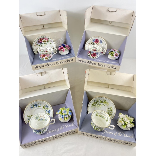 1193 - A full set of 12 boxed Royal Albert 'Flower of the Month' cup & saucer sets each with a flower displ... 