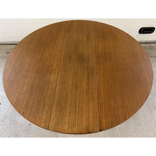 1395 - A vintage 1970's teak drop leaf slim dining table with gateleg supports. Approx. 74.5cm tall x 122cm... 