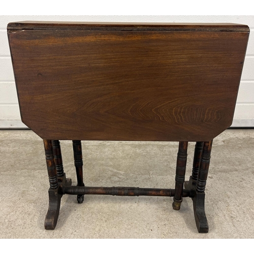 1400 - A small antique dark wood Sutherland style drop leaf table with turned detail to legs. Gateleg suppo... 