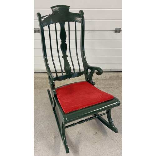 1401 - A vintage painted wood rocking chair with spindle back and turned detail. Painted dark green with re... 