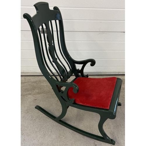 1401 - A vintage painted wood rocking chair with spindle back and turned detail. Painted dark green with re... 