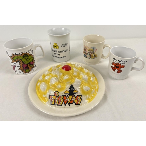 1194 - A small collection of vintage late 1970's & 1980's children's ceramics. An ATV Tiswas Phantom Flan F... 