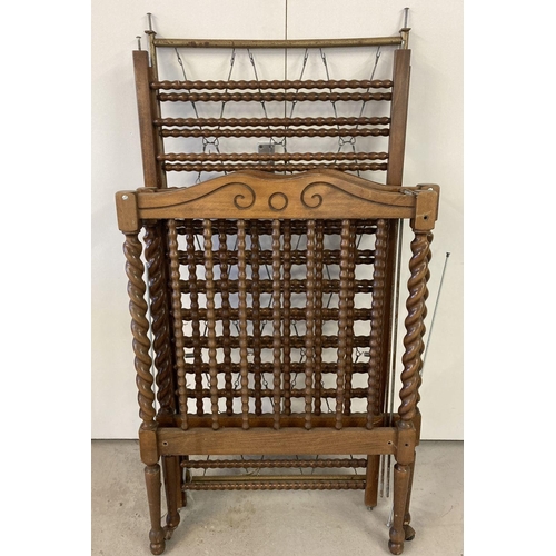 1403 - A vintage dark wood cot with barley twist posts and bobbin style spindles.