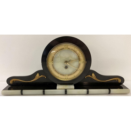 1181 - An Art Deco black slate and onyx mantle clock with gold scroll applique detail. Onyx face with gold ... 