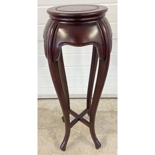 1404 - A vintage Oriental style hardwood jardiniere stand with circular shaped top and cabriole style shape... 