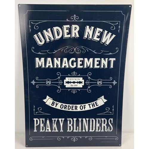 1168 - A large modern printed tin Peaky Blinders sign. With holes for wall fixing. Approx. 69.5cm x 50cm.