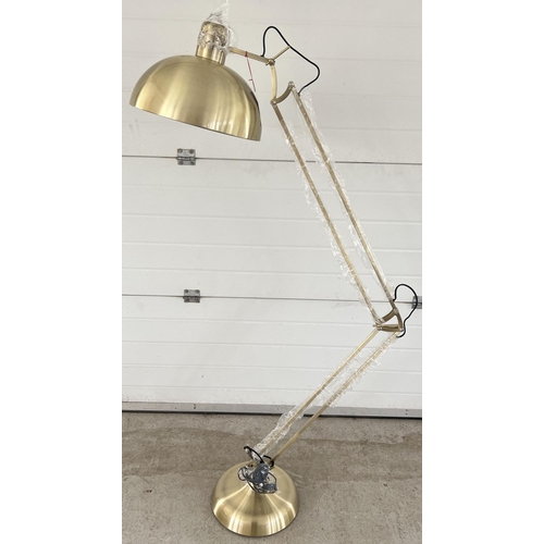 1387 - A new and unused brushed gold metal floor standing anglepoise standard lamp. Complete with original ... 