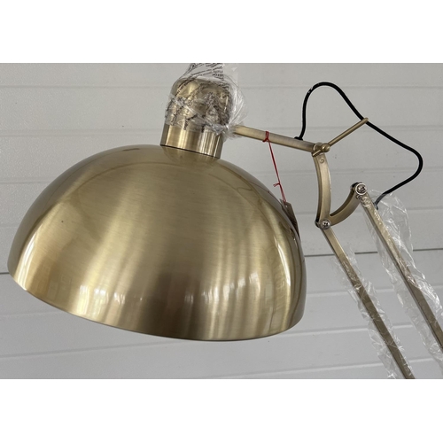 1387 - A new and unused brushed gold metal floor standing anglepoise standard lamp. Complete with original ... 