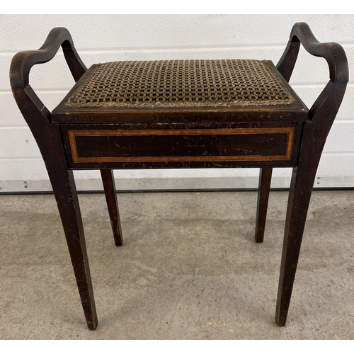 1406 - An Edwardian dark wood piano stool with curve design handle sides. Raised on square legs, with inlai... 