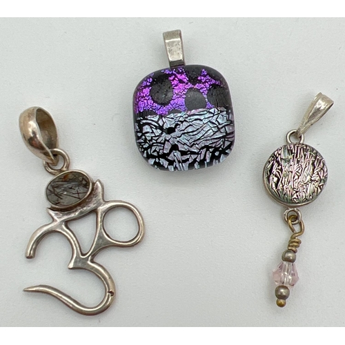 1095 - 3 stone set pendants. A silver Om pendant set with dendritic quartz; a silver drop pendant set with ... 