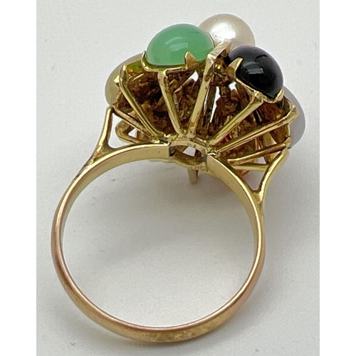 1100 - A vintage 14K gold multi stone set dress ring. Cathedral style mount set with 6 teardrop cut multi c... 