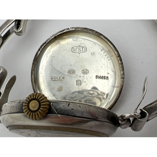 1199 - An antique silver WWI military wristwatch by Rolex. Fitted with a replacement sterling silver Bon Ma... 