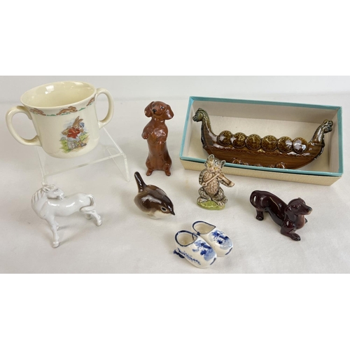 1240 - A small collection of vintage ceramics to include Wade, Royal Doulton, Goebel and Beswick. Lot inclu... 