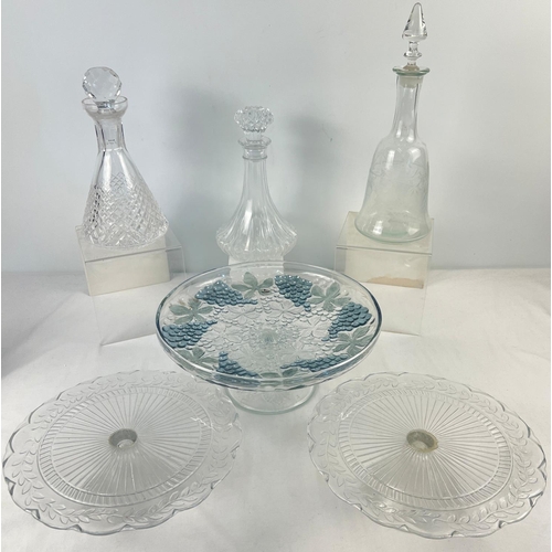 1262 - 3 vintage clear glass decanters together with 3 glass cake stands with pedestal bases. To include de... 