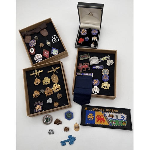 1357 - A collection of vintage Girl Guiding brass and enamel badges. Lots includes group leaders ribbon, 10... 