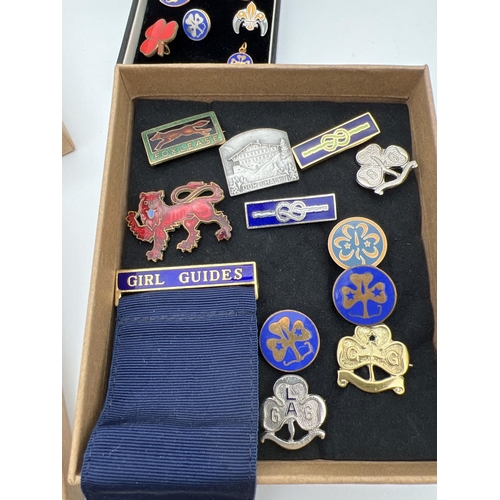 1357 - A collection of vintage Girl Guiding brass and enamel badges. Lots includes group leaders ribbon, 10... 