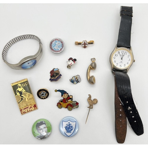 1358 - A collection of vintage pin badges together with a men's wristwatch by Rojas and a ladies wristwatch... 