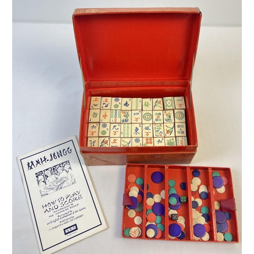 51 - A boxed 1920's Chad Valley Mah-Jong set in original red card box. A complete set of 144 wooden tiles... 