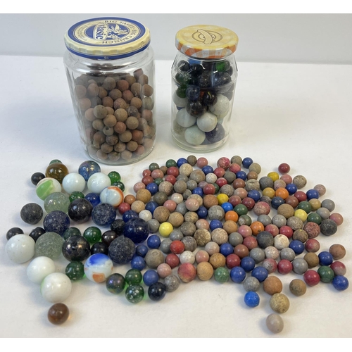 61 - A collection of assorted vintage glass, clay and stone marbles. In varying sizes & colours.