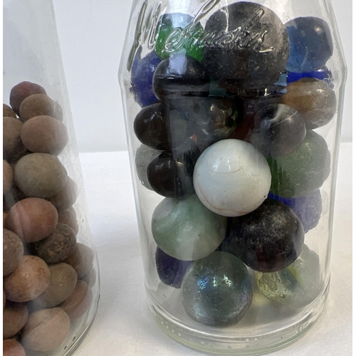 61 - A collection of assorted vintage glass, clay and stone marbles. In varying sizes & colours.