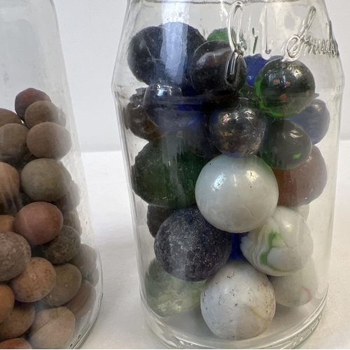 61 - A collection of assorted vintage glass, clay and stone marbles. In varying sizes & colours.