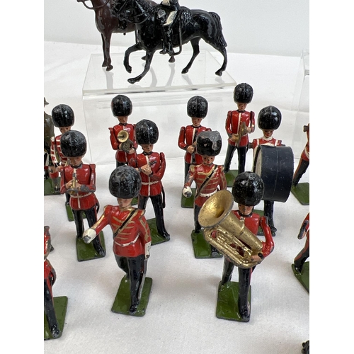 20 - A quantity of assorted painted lead soldier figures by Britains.