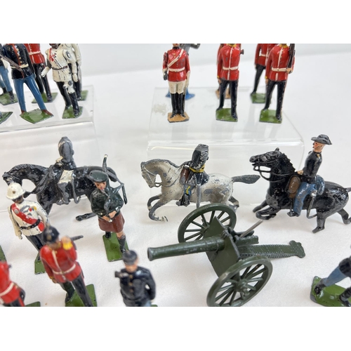 20 - A quantity of assorted painted lead soldier figures by Britains.