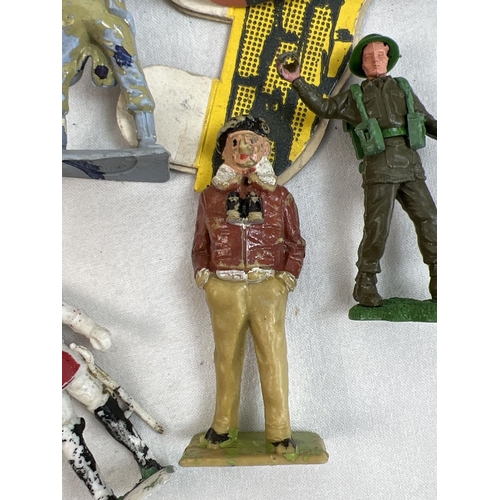 21 - A tin of assorted vintage painted lead and plastic soldiers, cowboys and figures. To include Britain... 