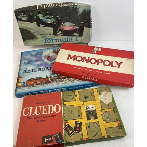 67 - 4 vintage 1960's & 70's boxed Waddington's board games - Formula 1, Railroader, Monopoly and Cluedo.