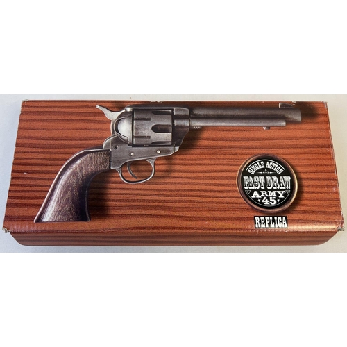 80 - A boxed Replica Single Action Army . 45 revolver toy gun with wood effect grip. Complete with imitat... 