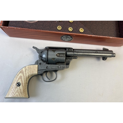 80 - A boxed Replica Single Action Army . 45 revolver toy gun with wood effect grip. Complete with imitat... 