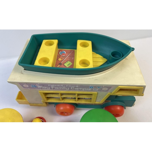 83 - A vintage Fisher Price Play Family Camper van with Boat and accessories. Age related sun fading to c... 