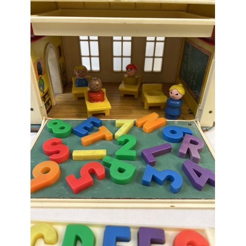 88 - A vintage Fisher Price School House with magnetic alphabet letters and numbers, figures and accessor... 