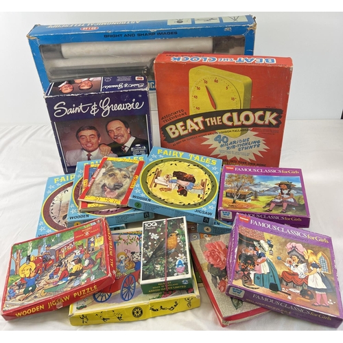 101 - A quantity of assorted vintage games, puzzles and toys. To include wooden jigsaw puzzles, Beat the C... 