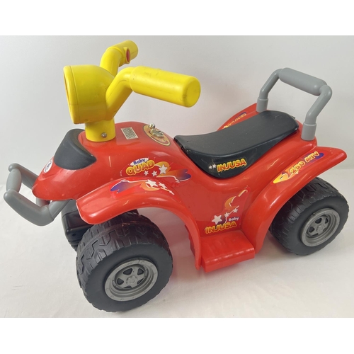 109 - A battery powered Baby Quad bike by Injusa with light and sound actions. Approx. 40cm to top of hand... 