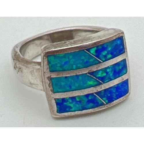 1010 - A modern square design silver dress ring set with opal. Silver marks to inside of band. Size P.