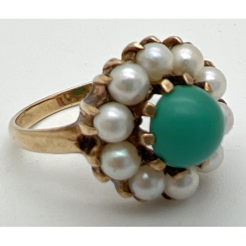 1015 - A vintage 9ct gold dress ring set with turquoise and pearls. Central round cabochon of blue turquois... 