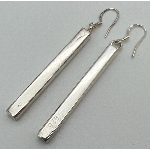 1017 - A pair of modern design solid silver rectangular drop earrings. Silver marks to body of earrings and... 